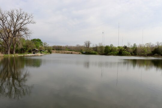 The calm lake in the country on a cloudy day.