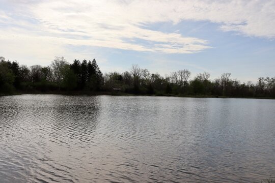 The peaceful lake in the country on a sunny day.