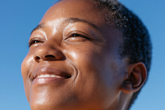 Serene close up of runner smiling morning sunlight cfbb d runner smiling morning sunlight close up portrait outdoor athletic skin joy happiness wellness healthy natural light youth short hair