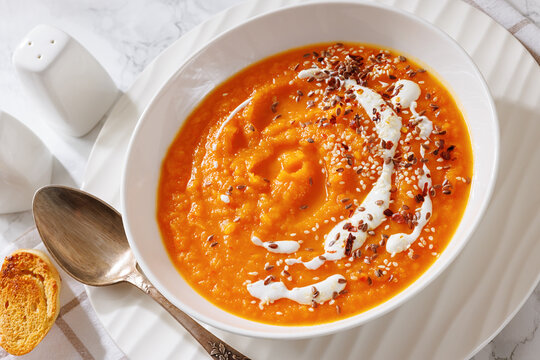 spiced sweet potato soup in a white bowl