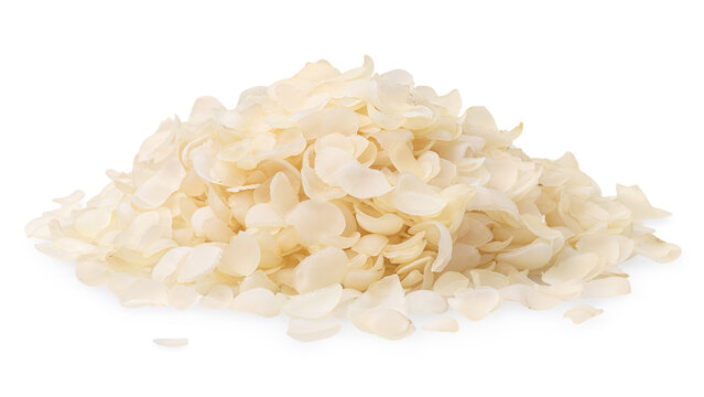 Pile of dry rice flakes rolled rice isolated on white background close up