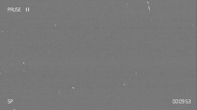 Vintage vhs pause screen with static and film grain noise overlay