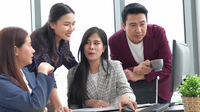 Asian entrepreneur group collaborates in office, fostering teamwork and cooperation to achieve their startup objectives. Their positive partnership drives success, creating a happy and successful job