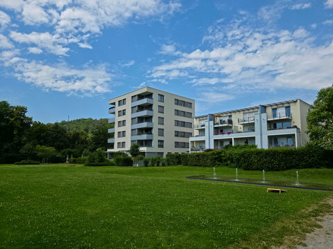 germany, contemporary riverside neighborhood surrounded by green trees in sunny summer plochingen city landscape