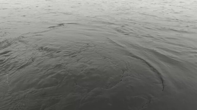 Golden Sunset Reflection On Calm Water Surface Creating Beautiful Ripples