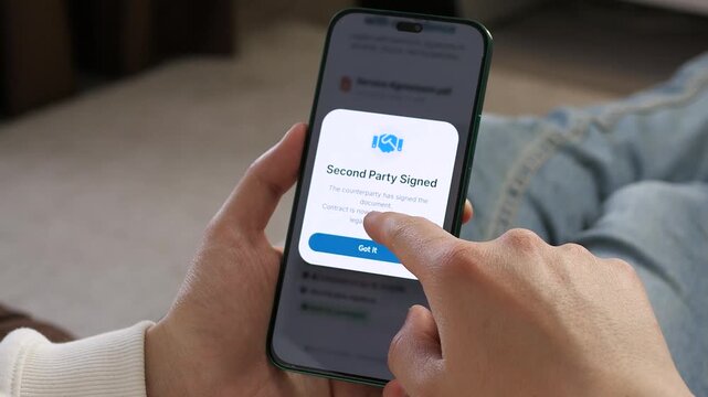 Seamless remote contract closing. Confirming a digital signature and receiving a fully executed agreement notification. Perfect for remote work, virtual offices, and SaaS deal-closing B-roll.
