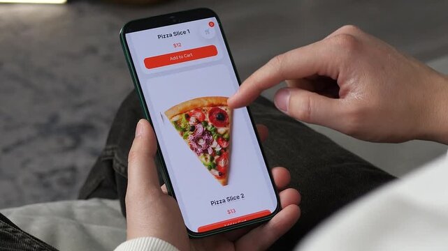 Person selecting a premium pizza selection from a mobile app at home. Shopping cart icon and pricing visible. High demand for takeout services, user-friendly interfaces, and comfort food advertising.