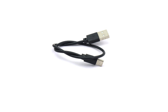A black USB cable on a white background. A USB cable for data transfer.