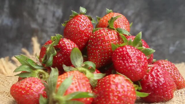 flat lay of a pile of strawberries on a table