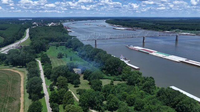 Ohio river tugboat barge traffic transport of consumer and industrial products at Mississippi, Ohio River Confluence