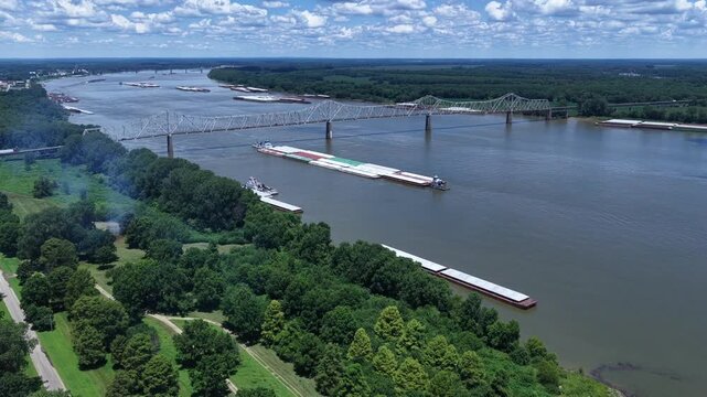 Ohio river tugboat barge traffic transport of consumer and industrial products at Mississippi, Ohio River Confluence