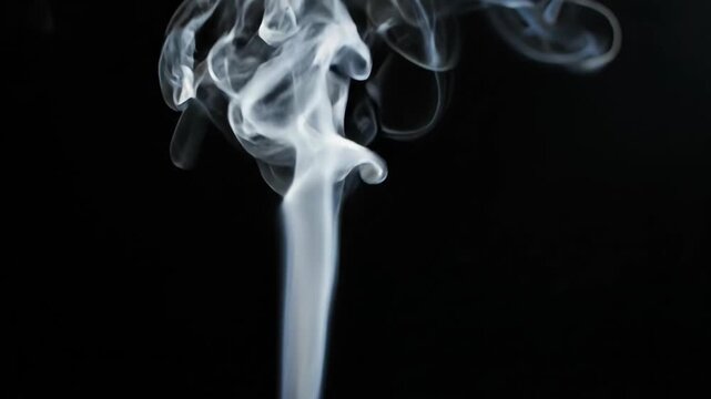 Abstract Smoke Patterns in Dark Backgrounds for Artistic Design.