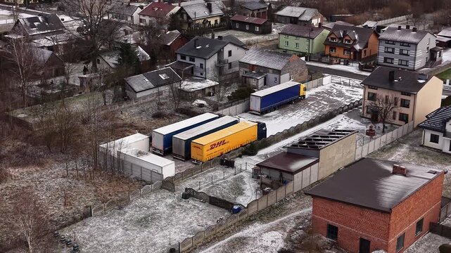 DHL semi trailers at freight depot captured from above