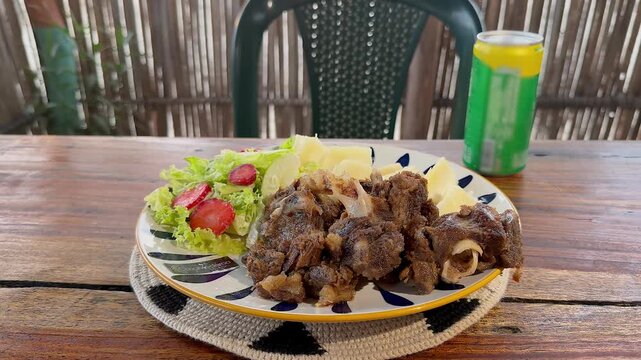 delicious traditional friche dish with salad and yuca