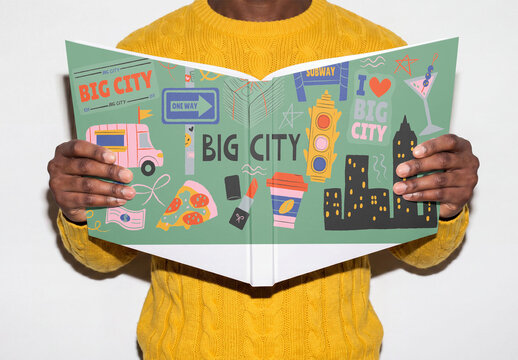 Mockup of Man stands with a blank book open 