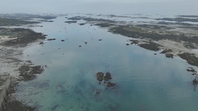 Aerial view of a boat in the mist off the Chausey islands, Normandy, France