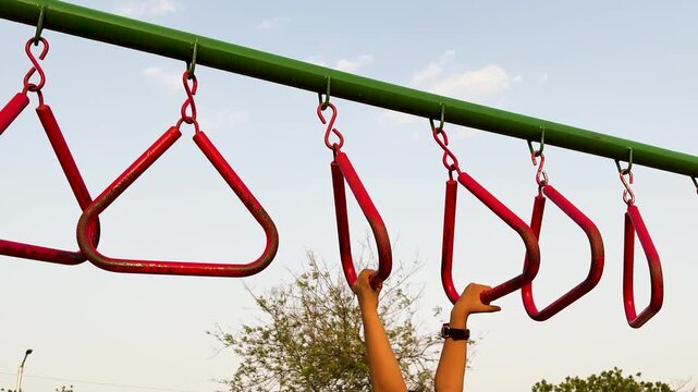 Kids Hands Holding Monkey Bars At Public Playground Fitness Equipment Outdoors