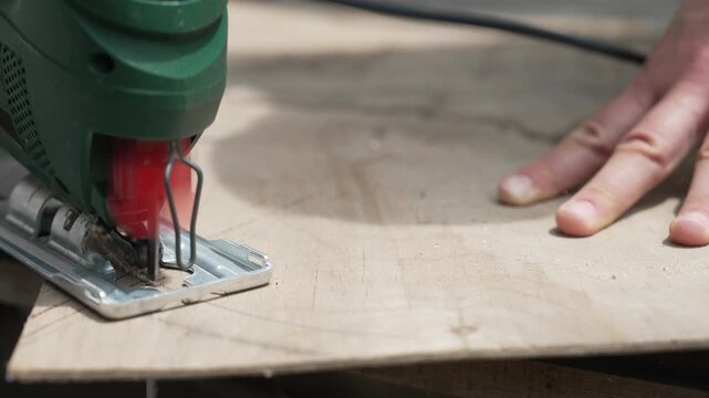 Furniture restoration process, woman repairing a classic wooden chair