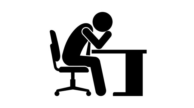 A person sitting at a desk looking stressed.