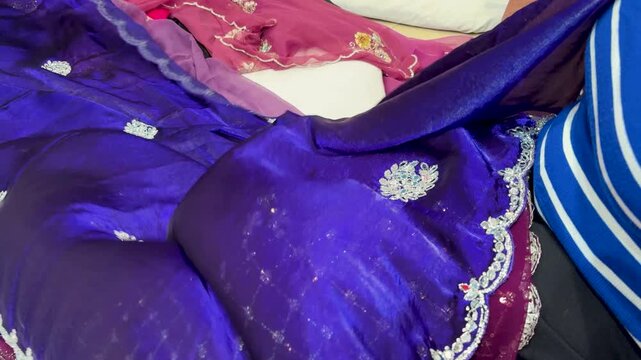 Elegant Royal Blue Embroidered Saree With Silver Border Displayed In Boutique