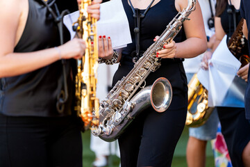 Obraz premium Young spanish musicians performing saxophone street concert
