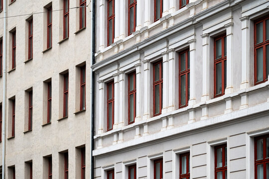 Across adjacent facades in Gr&uuml;nerl&oslash;kka, rows of windows frame the urban architecture of Oslo, while geometric detail and contrast shape a street in Norway.