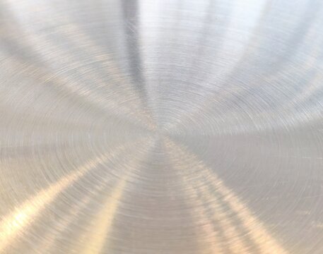 Brushed Metal Texture Background, Circular Polished Stainless Steel Surface, Shiny Silver Abstract Metallic Pattern for Industrial Design Backdrop.