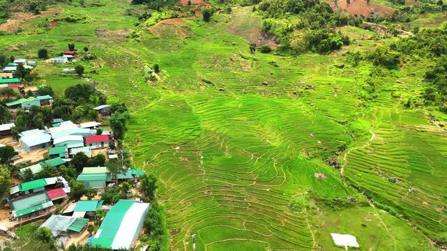 Aerial View of Newly Planted Terraced Rice Fields and Xo Dang Granaries in Mang Ri, Quang Ngai, Vietnam