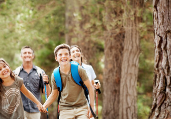 Naklejka premium Parents, laugh and kids in nature with hiking gear, joke and adventure outdoor for bonding together. Space, happy mother and father in woods with funny children, trekking or holding hands for support