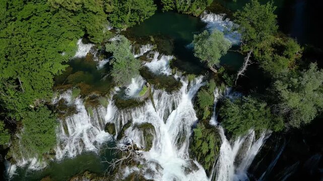 Drone View of Martin Brod Waterfalls in Una National Park, Bosnia and Herzegovina Surrounded by Lush Nature