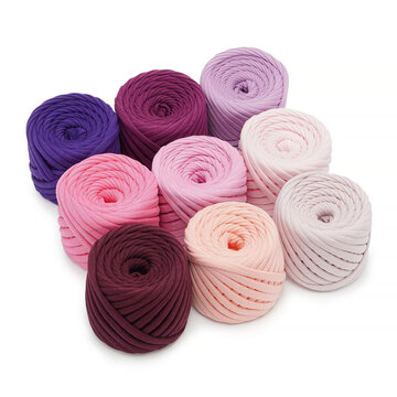 Professional studio product photography featuring a beautiful layout of ribbon yarn skeins. Perfect presentation template of colorful t-shirt fabric cords for retail store catalog.