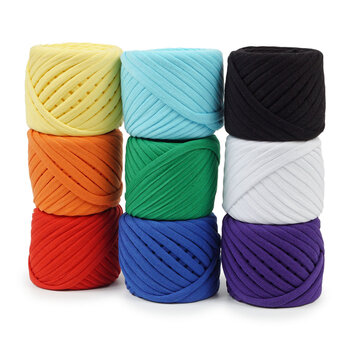 Professional studio product photography featuring a neat grid of ribbon yarn skeins. Perfect layout template of colorful t-shirt fabric cords for online retail store catalog.