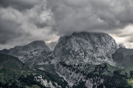 Storm clouds above the Carnic Alps peaks. Italian alpine landscape, Friuli Venezia Giulia, Udine province, Italy.	