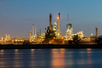 Obraz premium Modern petrochemical industry and oil refinery factory at night, Netherlands, Benelux, Europe