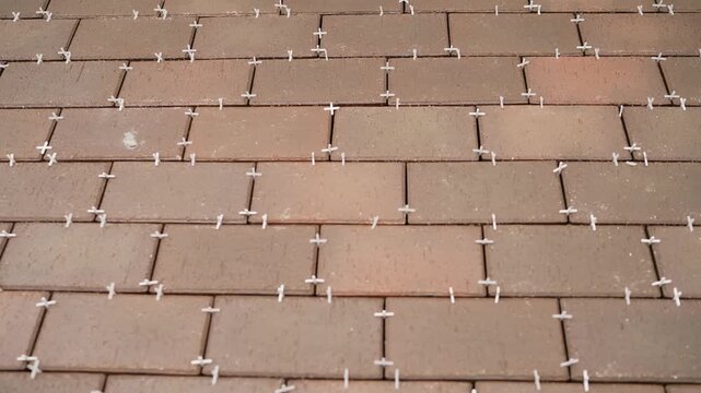 Paver Installation Progression. Scene progresses from initial layout to near completion.