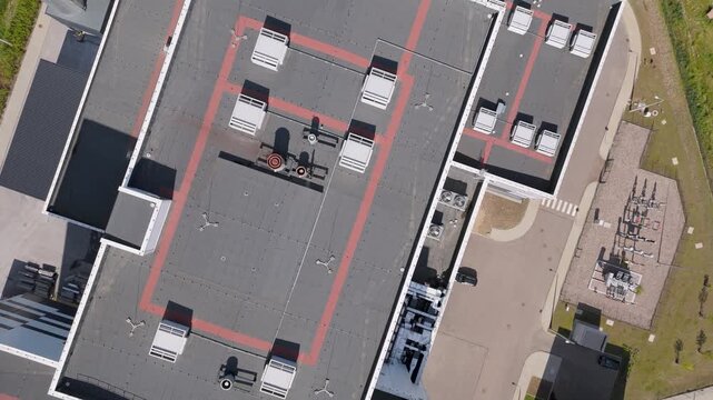 top-down view of modern industrial facility rooftop with ventilation systems, representing sustainable waste management and green infrastructure.