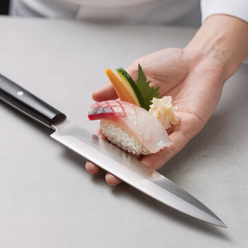 Sketch Sushi Chef. Sushi Presented On A Japanese Knife Held By Chef