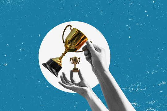 Flat-design illustration. Hands hold up various trophies one small, the other large&mdash;against a simple background; a concept representing awards, victory, and competition.