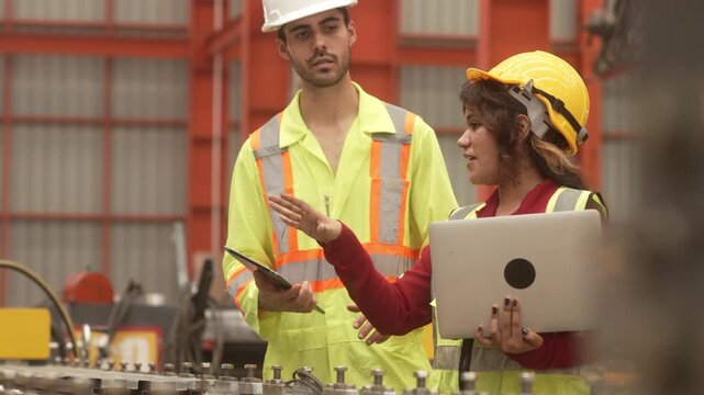 Supervisors inspecting production workflow and monitoring factory operations with digital technology. Manufacturing management, industrial innovation and operational efficiency.
