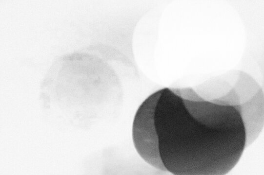 Abstract Bokeh Lights and Grainy Texture on Dark Background