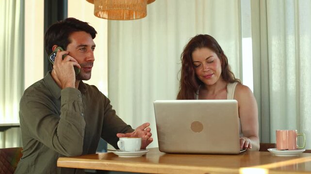 Digital nomads working remotely in a modern coffee shop