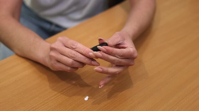 Glucose meter. needle. The pen is a blood glucose meter needle. female hands. slow motion video. High quality 4k footage
