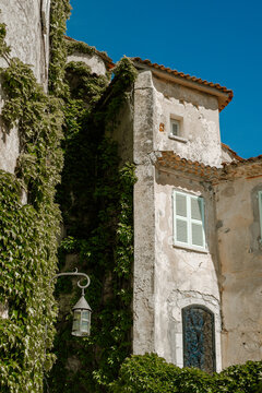 Ivy-Covered Stone House With Vintage Street Lantern