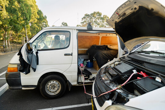UGC campervan with open hood during roadtrip battery trouble