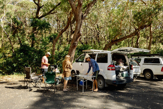 UGC friends setting up camp kitchen in national park parking area