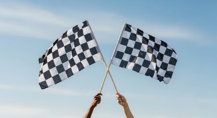 Obraz premium Diverse Hands Holding Crossed Checkered Racing Flags Against a Clear Blue Sky, Symbolizing Victory and Success