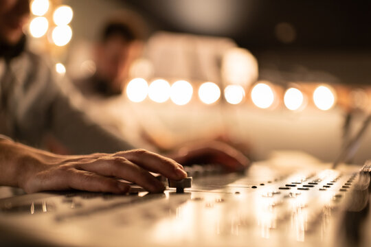 Cropped male sound director recording music.
Men in sound studio