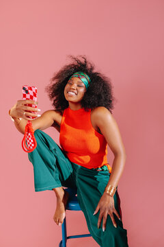 Happy fashionable woman taking a selfie
