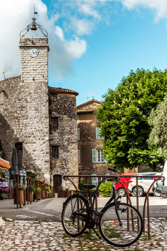Bicycle Parked by Medieval Clock Tower in Tourrettes-sur-Loup