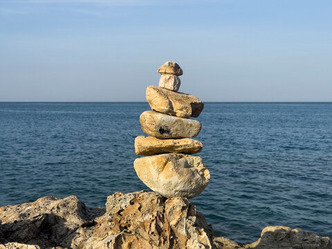 Stone Cairn Overlooking Calm Sea